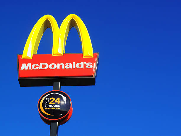 McDonald's representatives handing over donations to a charity.